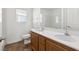 A bathroom with double sinks, tile flooring, and a large mirror at 6636 Surfbird St, North Las Vegas, NV 89084