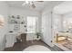 Bright bedroom with natural light, modern decor, and a convenient built-in desk and shelving unit at 6636 Surfbird St, North Las Vegas, NV 89084