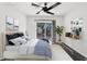 Comfortable bedroom featuring a king bed, sliding glass doors to the backyard, and a stylish decor at 6636 Surfbird St, North Las Vegas, NV 89084