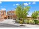 Inviting home featuring a landscaped front yard and a concrete driveway leading to the garage at 6636 Surfbird St, North Las Vegas, NV 89084