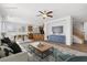 Spacious living area with a ceiling fan, comfortable seating, and an open layout connecting to the kitchen at 6636 Surfbird St, North Las Vegas, NV 89084