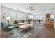 Open-concept living room connected to the kitchen and dining area, with comfortable seating at 6636 Surfbird St, North Las Vegas, NV 89084
