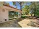 Backyard featuring mature trees, rock landscaping and a patio at 6944 Emerald Springs Ln, Las Vegas, NV 89113