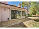 Backyard featuring mature trees, rock landscaping and a patio at 6944 Emerald Springs Ln, Las Vegas, NV 89113