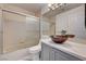 Relaxing bathroom featuring a shower, vanity, decorative vessel sink, and great lighting at 6944 Emerald Springs Ln, Las Vegas, NV 89113