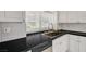 Beautiful kitchen featuring granite counters, modern stainless steel appliances, and a window view at 6944 Emerald Springs Ln, Las Vegas, NV 89113