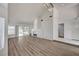 Open living area boasting wood floors, a modern fireplace, and sliding glass doors at 6944 Emerald Springs Ln, Las Vegas, NV 89113