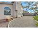 A backyard with a graveled area, bench and desert landscaping at 7528 Golden Yucca Dr, Las Vegas, NV 89147