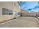 Gravel backyard featuring a grill and privacy walls at 7528 Golden Yucca Dr, Las Vegas, NV 89147