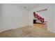 The bedroom shows the open door to the home's unique red staircase feature at 7528 Golden Yucca Dr, Las Vegas, NV 89147