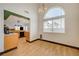Dining area showcasing wood floors, bright light and access to the kitchen at 7528 Golden Yucca Dr, Las Vegas, NV 89147