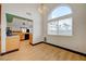 Dining area with wood-look floors, kitchen access, and bright natural light at 7528 Golden Yucca Dr, Las Vegas, NV 89147