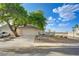 Beautiful single story home with two-car garage, desert landscaping and a mature shade tree on a corner lot at 7528 Golden Yucca Dr, Las Vegas, NV 89147