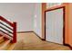 Inviting foyer featuring wood-look floors, a white front door, and a staircase at 7528 Golden Yucca Dr, Las Vegas, NV 89147