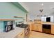 Well-lit kitchen boasts wood cabinets, modern appliances, and quartz countertops at 7528 Golden Yucca Dr, Las Vegas, NV 89147