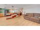 Spacious living room adjacent to kitchen with modern flooring and comfortable seating at 7528 Golden Yucca Dr, Las Vegas, NV 89147