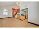 Open living area with modern staircase, kitchen access, and natural light at 7528 Golden Yucca Dr, Las Vegas, NV 89147