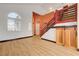 Bright living room area featuring hardwood floors and a modern staircase at 7528 Golden Yucca Dr, Las Vegas, NV 89147
