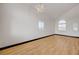 Bright and airy living room featuring wood-look floors and ample sunlight at 7528 Golden Yucca Dr, Las Vegas, NV 89147