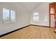 Bright living room featuring wood-look floors and windows that bring in natural light at 7528 Golden Yucca Dr, Las Vegas, NV 89147