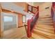 Eye-catching home features a unique red staircase leading to the second floor of the home at 7528 Golden Yucca Dr, Las Vegas, NV 89147