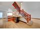 Modern staircase with a wet bar underneath, flowing layout, and light floors at 7528 Golden Yucca Dr, Las Vegas, NV 89147