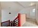 View of the upstairs landing and staircase, with bedroom access and natural lighting at 7528 Golden Yucca Dr, Las Vegas, NV 89147