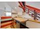 Wet bar with cabinets and wooden counter is located underneath the stairs at 7528 Golden Yucca Dr, Las Vegas, NV 89147