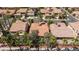 Aerial view showcases a home with a tile roof and mature landscaping in a neighborhood at 7609 Slide Rock Ave, Las Vegas, NV 89113