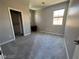Bedroom with neutral walls, carpet, a closet, and a window with a view at 7609 Slide Rock Ave, Las Vegas, NV 89113