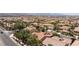 Expansive neighborhood view with many homes, palm trees, and mountain backdrop at 7609 Slide Rock Ave, Las Vegas, NV 89113