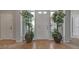 Bright foyer with tile floors, a white front door, and potted plants to bring the outdoors in at 7609 Slide Rock Ave, Las Vegas, NV 89113