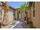 Inviting front entrance with desert landscaping, decorative plants, and a neutral-colored front door at 7609 Slide Rock Ave, Las Vegas, NV 89113
