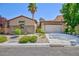 Charming single-story home with a two-car garage, neutral paint, desert landscaping, and a red tile roof at 7609 Slide Rock Ave, Las Vegas, NV 89113