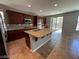 Kitchen island features a stainless sink and granite countertop at 7609 Slide Rock Ave, Las Vegas, NV 89113