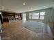 Modern kitchen with a breakfast bar, stainless steel appliances, tile floors, and natural light at 7609 Slide Rock Ave, Las Vegas, NV 89113