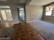 Open living space featuring ample natural light and tile and carpet flooring at 7609 Slide Rock Ave, Las Vegas, NV 89113