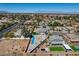 Spacious lot with a modern home, a pool, and desert landscaping at 7736 Tioga Ridge Ct, Las Vegas, NV 89117