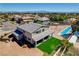 Spacious backyard featuring a pool, desert landscaping and an outdoor seating area at 7736 Tioga Ridge Ct, Las Vegas, NV 89117