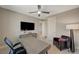 Comfortable bedroom with a desk, office chair, TV, and leather chair at 7736 Tioga Ridge Ct, Las Vegas, NV 89117