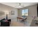 Bright bedroom with a large window, desk, office chair, and decor at 7736 Tioga Ridge Ct, Las Vegas, NV 89117