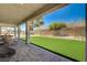 Serene covered patio with views of the pool and backyard, creating a relaxing outdoor space at 7736 Tioga Ridge Ct, Las Vegas, NV 89117