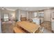 Open-concept design featuring an airy dining area that seamlessly connects the living room and modern kitchen at 7736 Tioga Ridge Ct, Las Vegas, NV 89117
