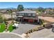 Beautiful home with manicured landscaping, stone accents, and a three-car garage at 7736 Tioga Ridge Ct, Las Vegas, NV 89117