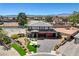 Beautiful home with manicured landscaping, stone accents, and a three-car garage at 7736 Tioga Ridge Ct, Las Vegas, NV 89117