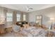 Bright living room with modern furniture, large windows, and stylish decor at 7736 Tioga Ridge Ct, Las Vegas, NV 89117