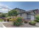 A spacious home with a well-manicured lawn and mature landscaping at 7919 Dexter Falls St, Las Vegas, NV 89149