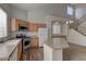 Well-lit kitchen featuring stainless steel appliances, with an island at 7919 Dexter Falls St, Las Vegas, NV 89149