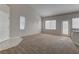 Spacious living room featuring a large window for natural light and neutral walls at 7919 Dexter Falls St, Las Vegas, NV 89149