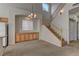 Cozy living area with staircase access, great natural light, and storage at 7919 Dexter Falls St, Las Vegas, NV 89149